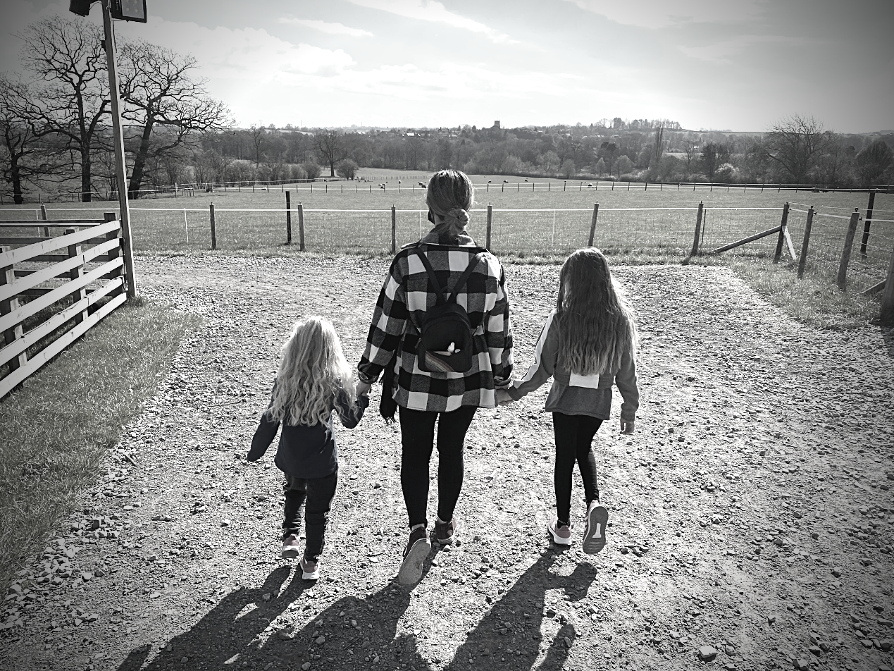 Kirsten walkig with her two daughters